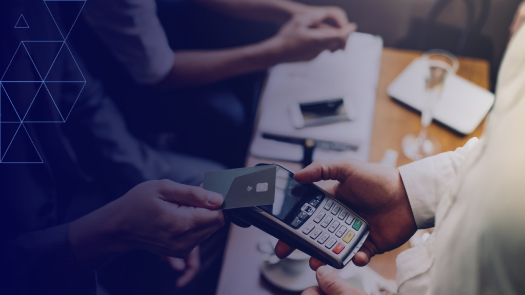 A person tapping their credit card on an EFTPOS machine